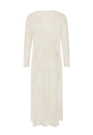  wearing a sheer white lace longline cardigan over a white lace camisole top and blue jeans